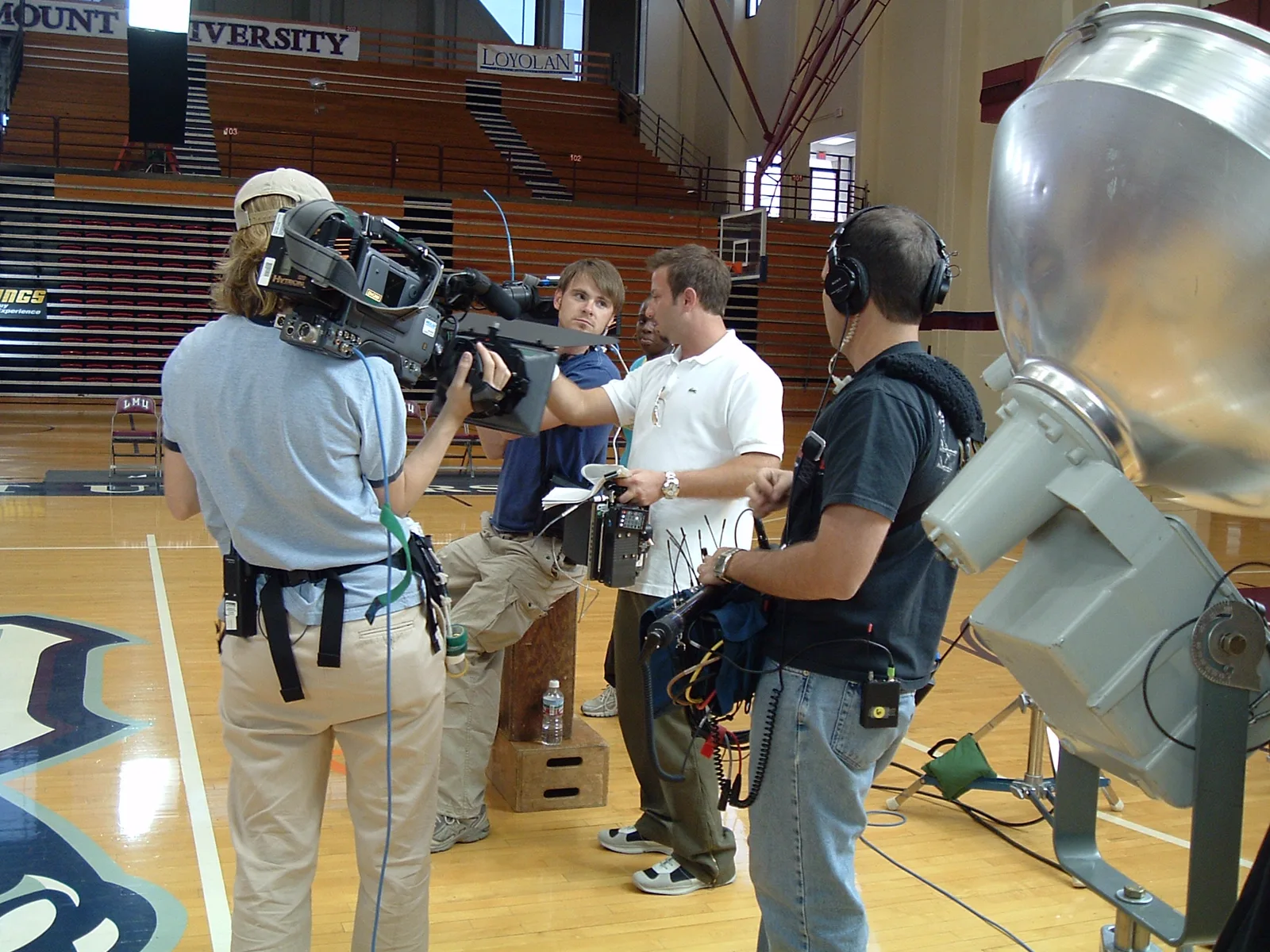 Camera and audio crew preparing for live sports production